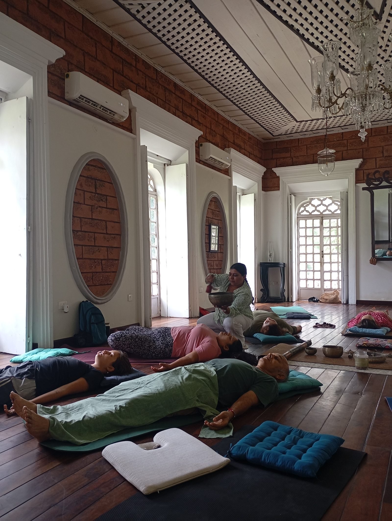Yoga Nidra class at La Waha, students lying in Shavasana